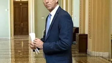 john thune looks back in an empty hall on capitol hill